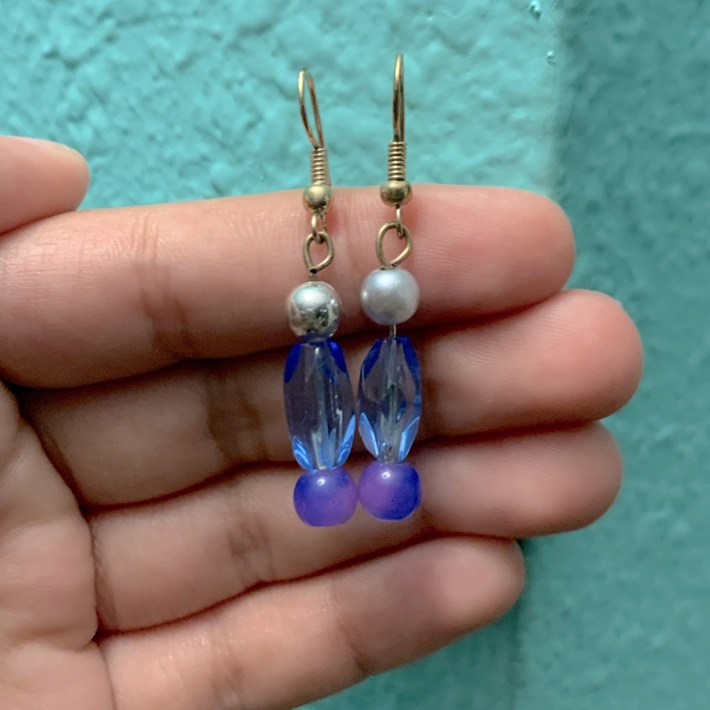 Silver,blue, & purple dangling earring.